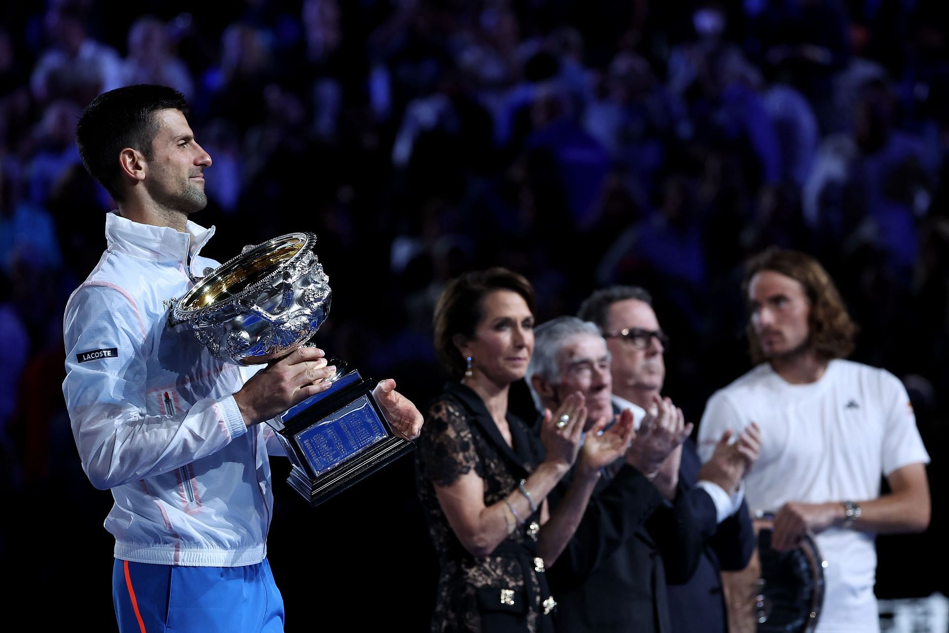 Novak Djokovic poses with the Norman Brookes Challenge Cup after winning the Final match against Stefanos Tsitsipas