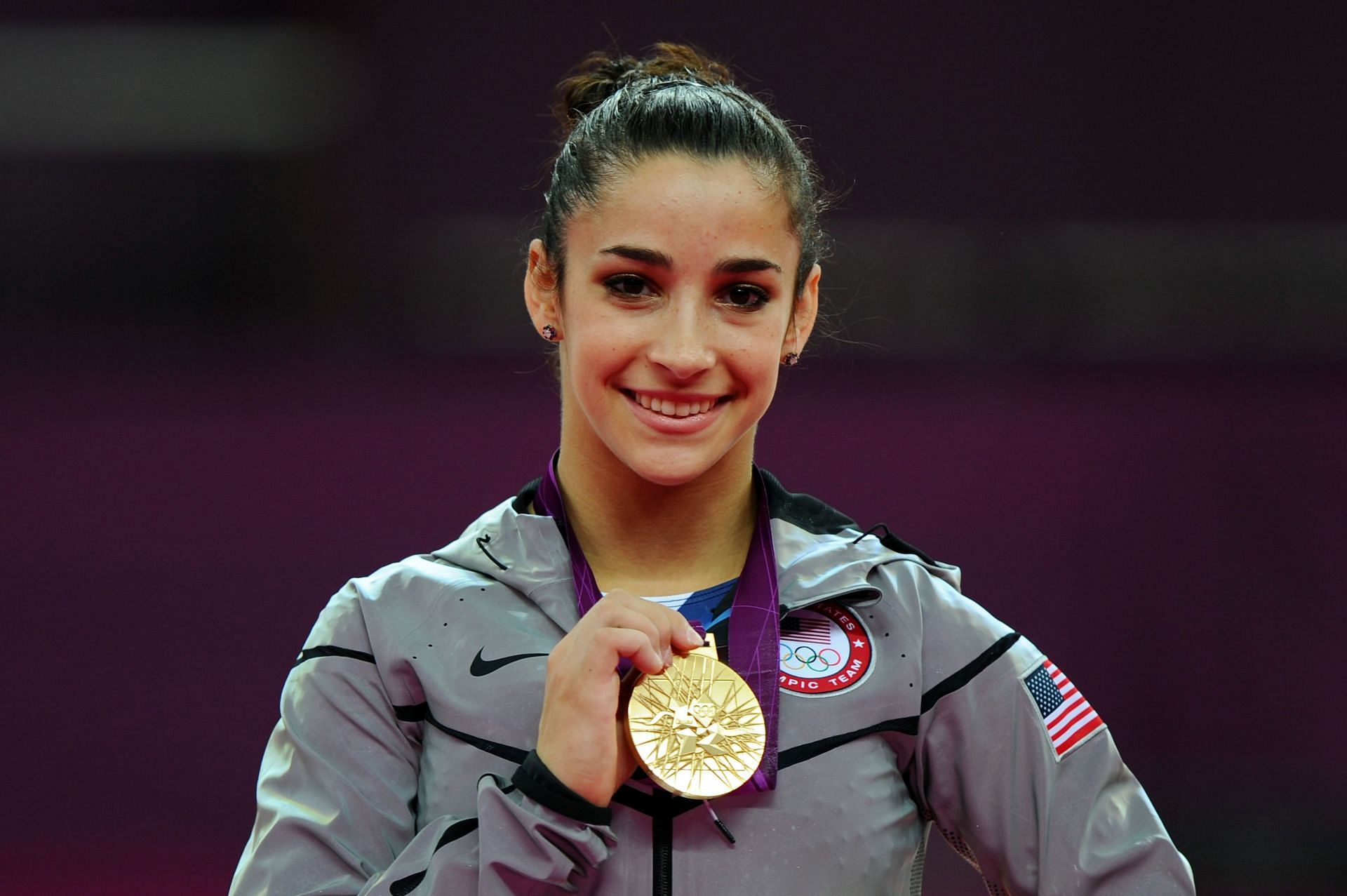 Alexandra Raisman of the United States poses on the podium during the medal ceremony for the Artistic Gymnastics Women&#039;s Floor Exercise final on Day 11 of the London 2012 Olympic Games at North Greenwich Arena. (Photo by Michael Regan/Getty Images)