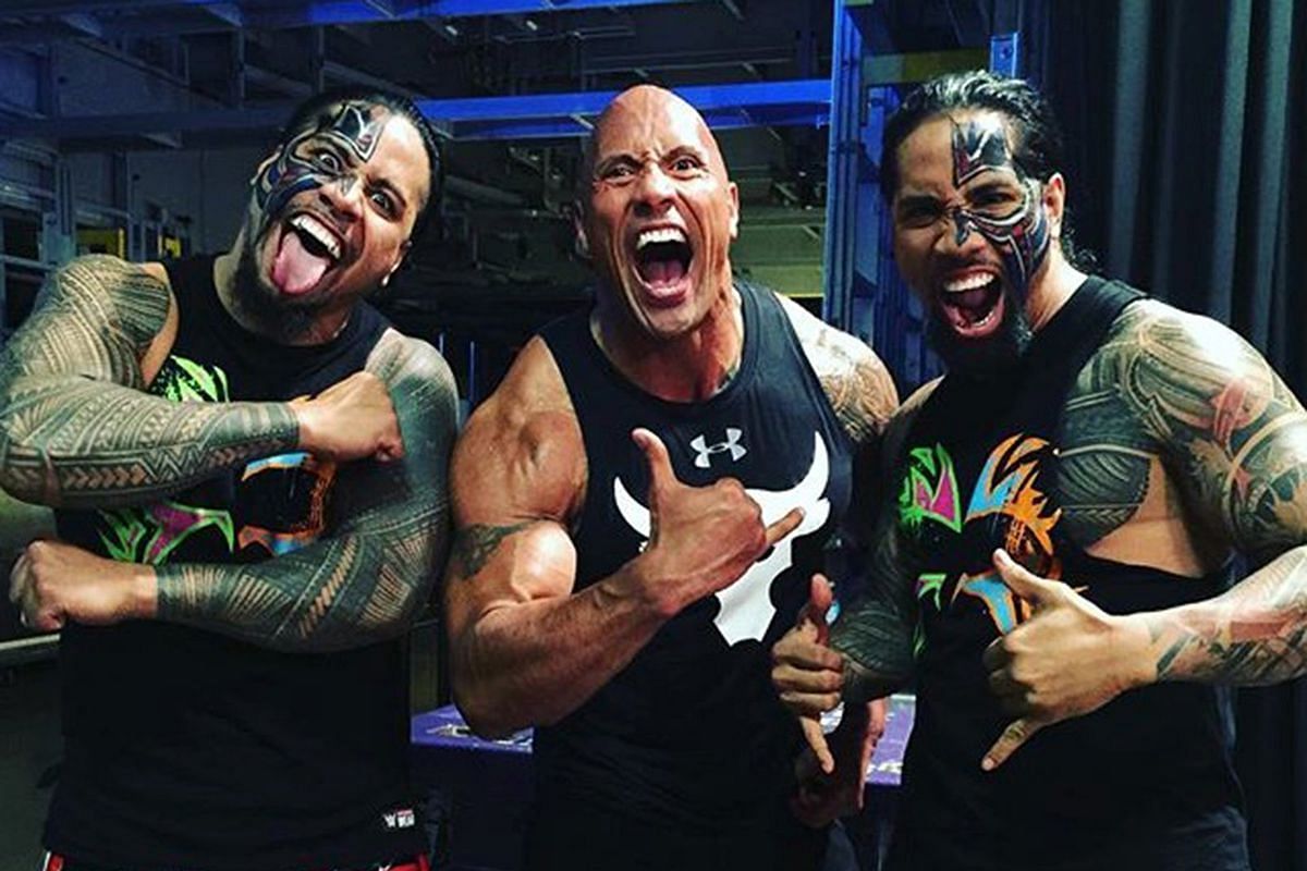 The Usos with the WWE legend