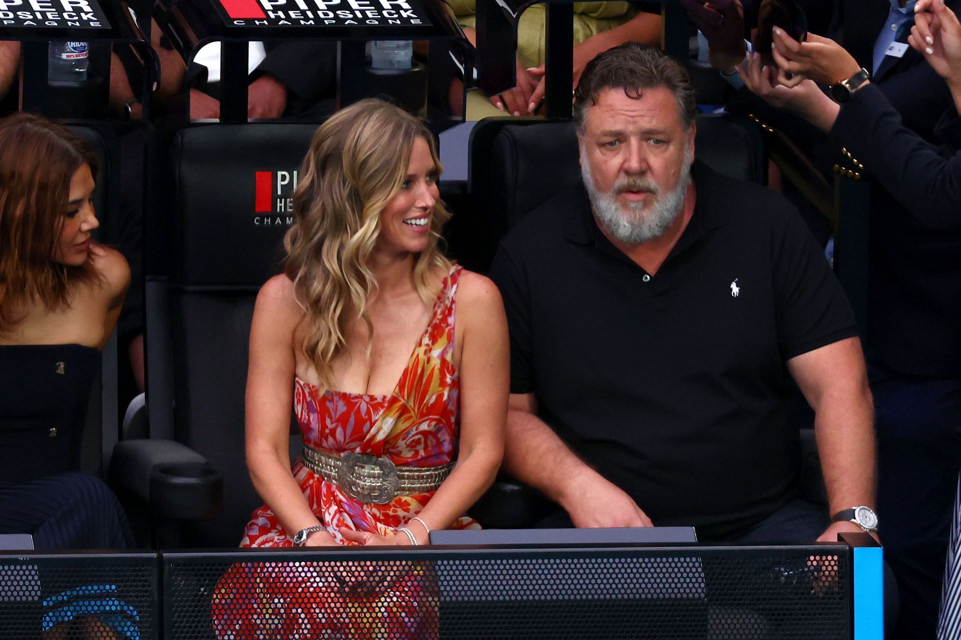 Britney Theriot (L) and Russell Crowe