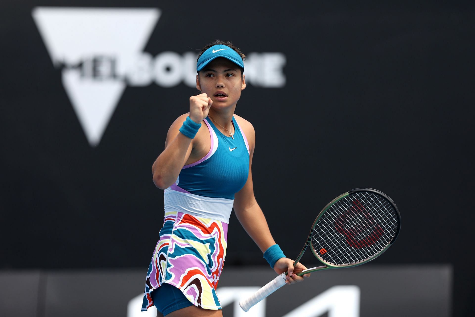 Emma Raducanu reacts in their round one singles match against Tamara Korpatsch