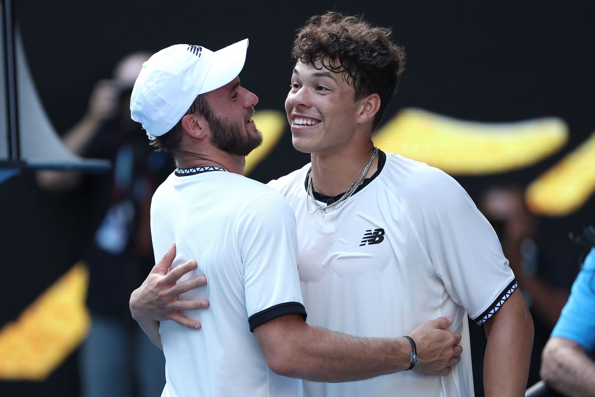 Ben Shelton (right) hugs Paul at the net after his quarterfinal defeat.