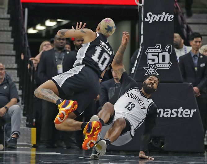 Fans send in rib-tickling reactions as Markieff Morris and Jeremy Sochan square off during Brooklyn Nets vs San Antonio Spurs
