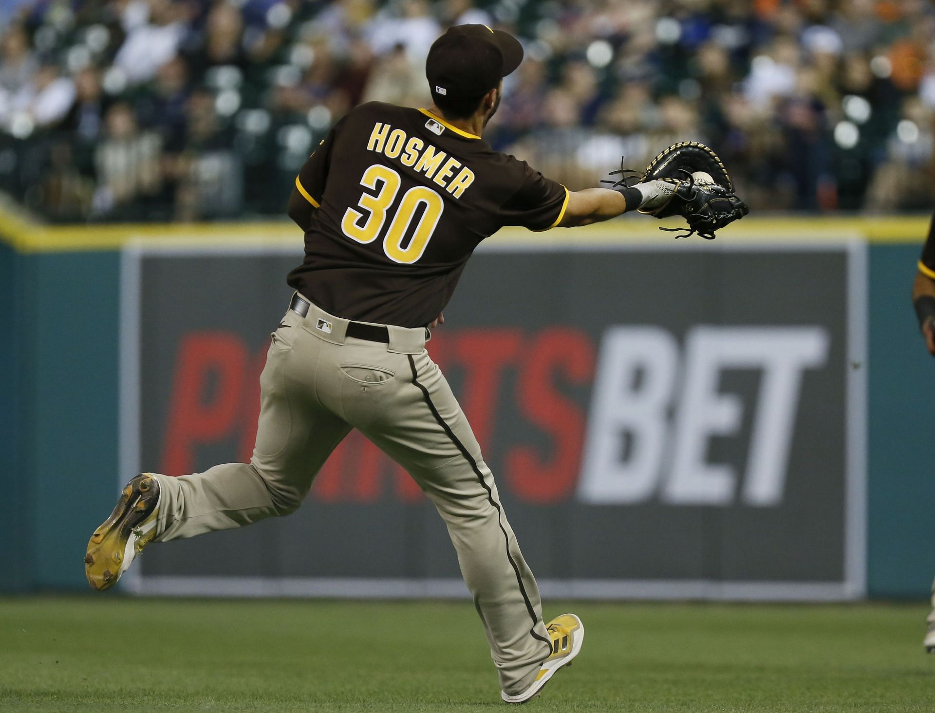 First baseman Eric Hosmer reaches out to catch a fly ball at Comerica Park