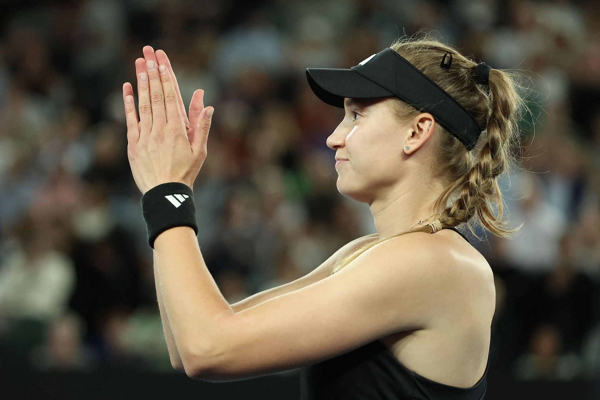 Rybakina waves to the crowd in the Semifinals singles match against Victoria Azarenka