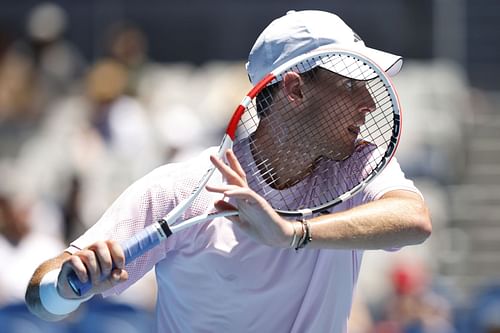 Dominic Thiem plays a forehand in their round one singles match against Andrey Rublev