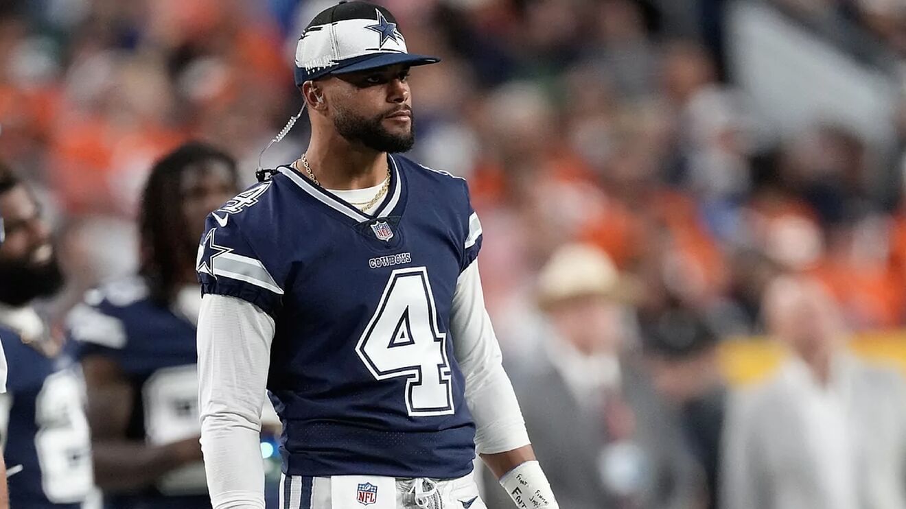 Dallas Cowboys quarterback Dak Prescott steps off the riser after