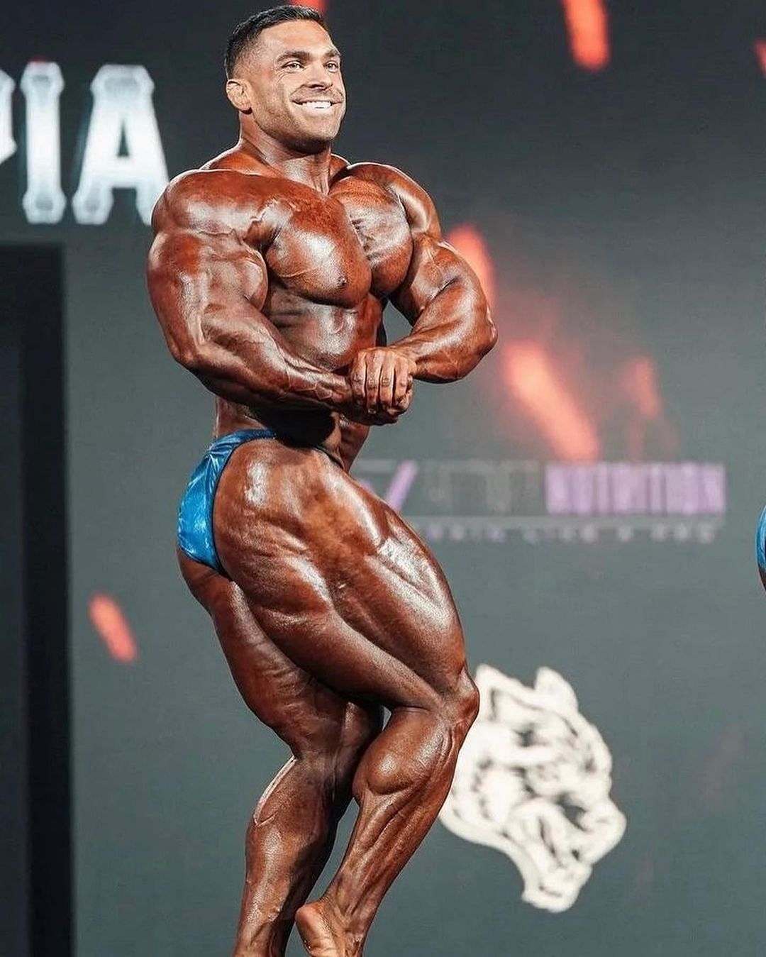 Lunsford poses on stage at the 2022 Mr. Olympia (Image via Instagram/@dereklunsford_)
