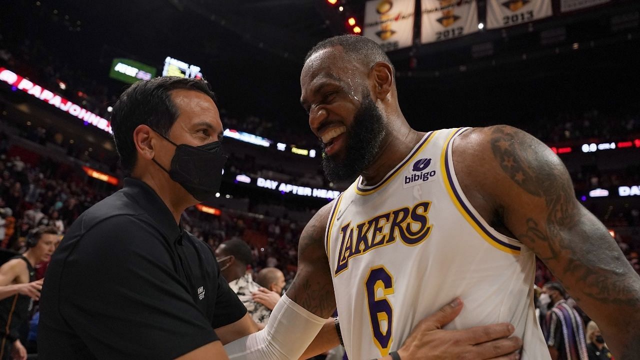 Miami Heat coach Erik Spoelstra speaking with his former player LeBron James