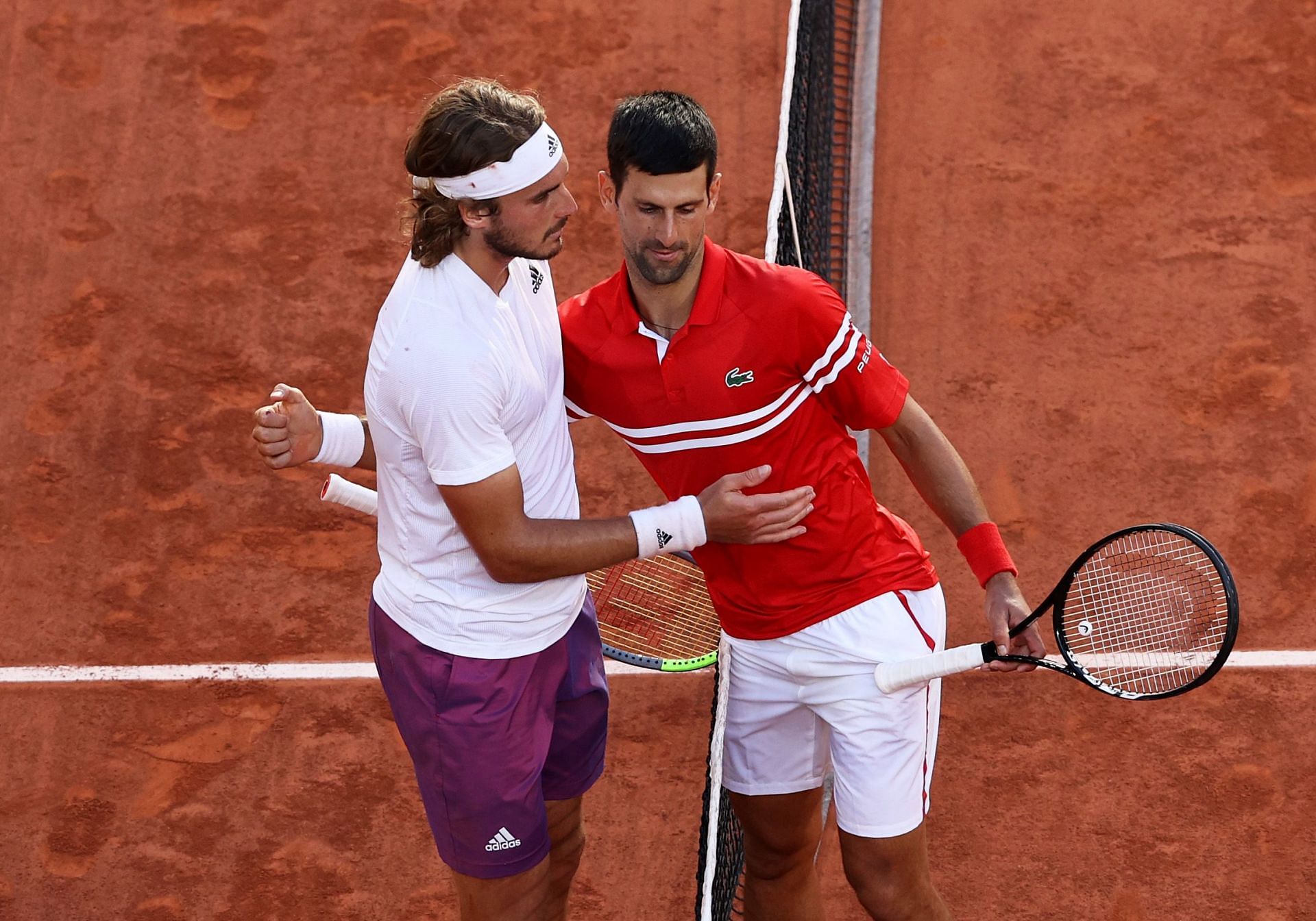 Stefanos Tsitspas (L) and Novak Djokovic