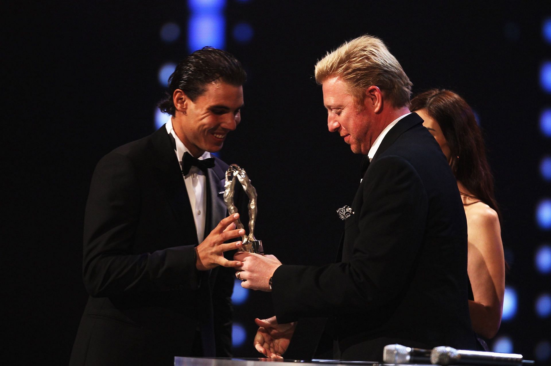 The Spanish superstar accepting an award from Boris Becker