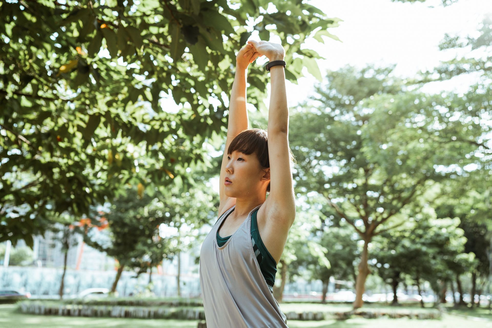 Arm circles and arm scissors will help you tone your arms (Image via Pexels/Ketut Subiyanto)