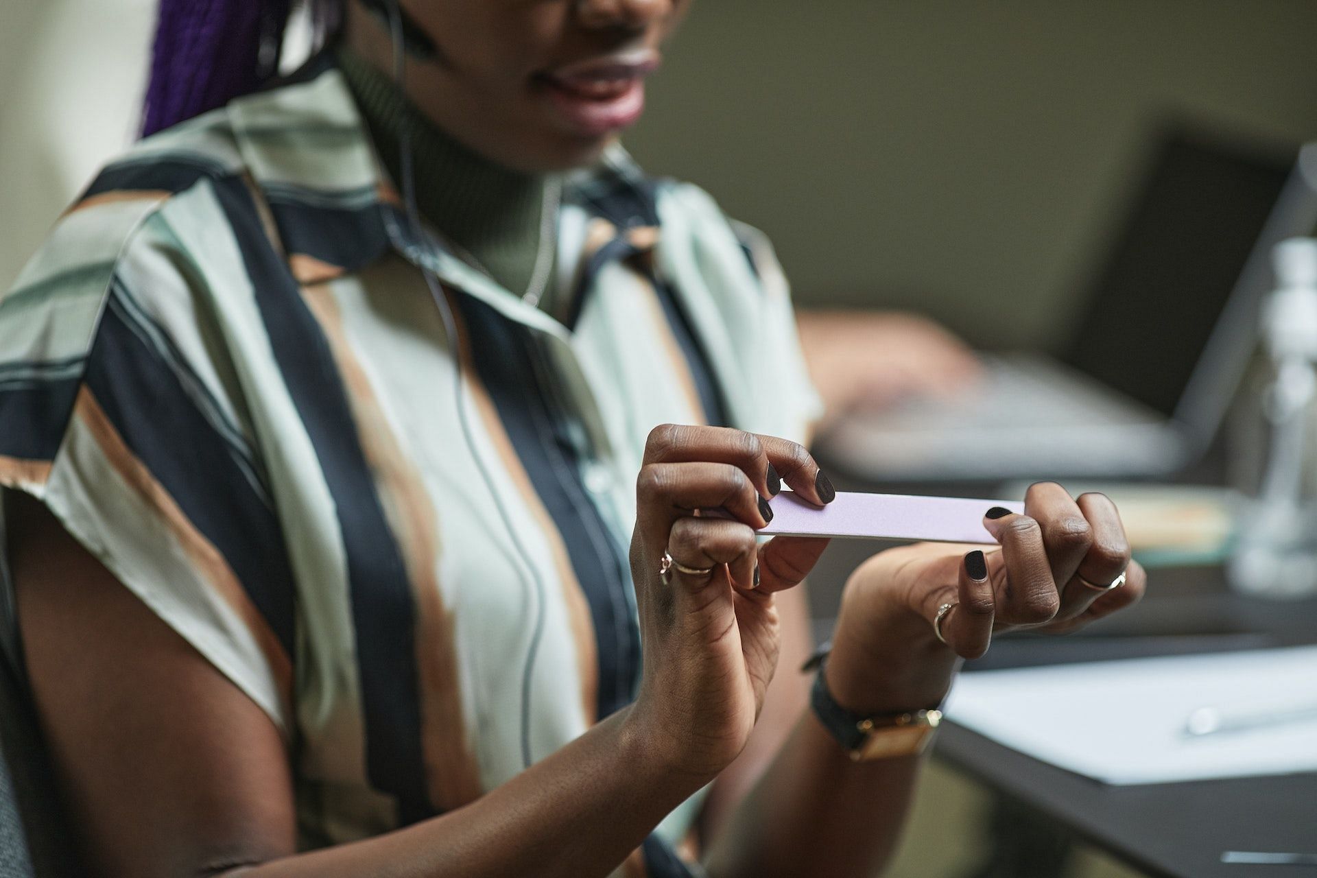 Weak nails are a sign of biotin deficiency. (Photo via Pexels/Jep Gambardella)