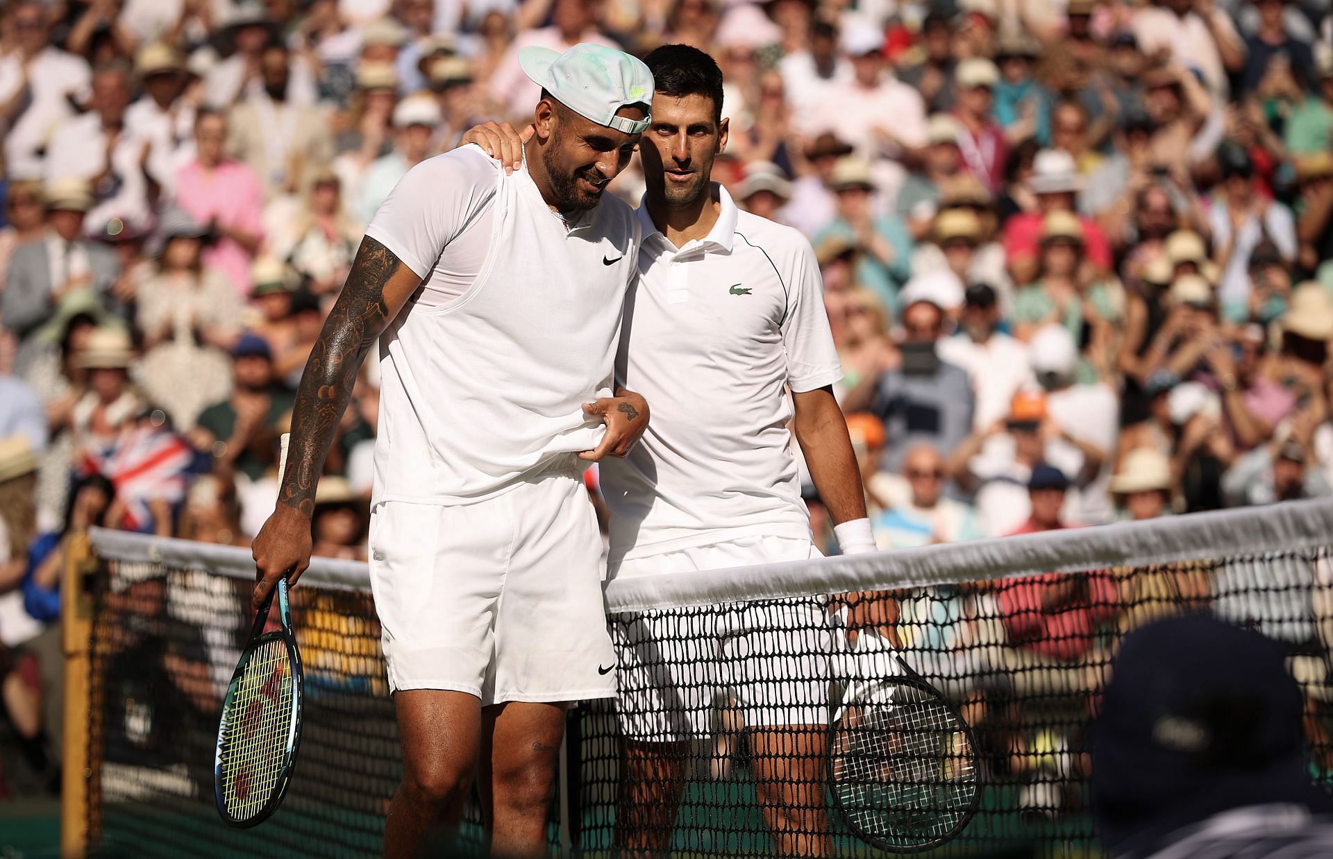 Nick Kyrgios and Novak Djokovic pictured at Wimbledon 2022.