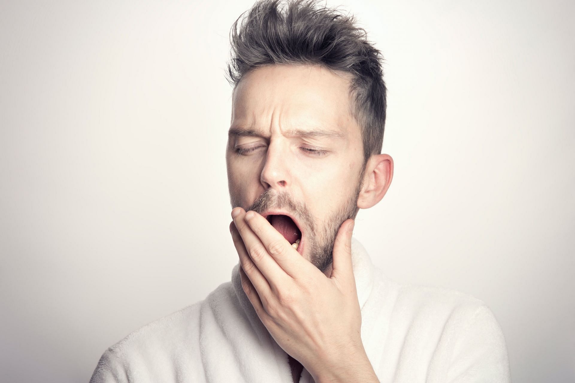 Humans yawn five to ten times per day on average.(Image via Unsplash/Sander Sammy)