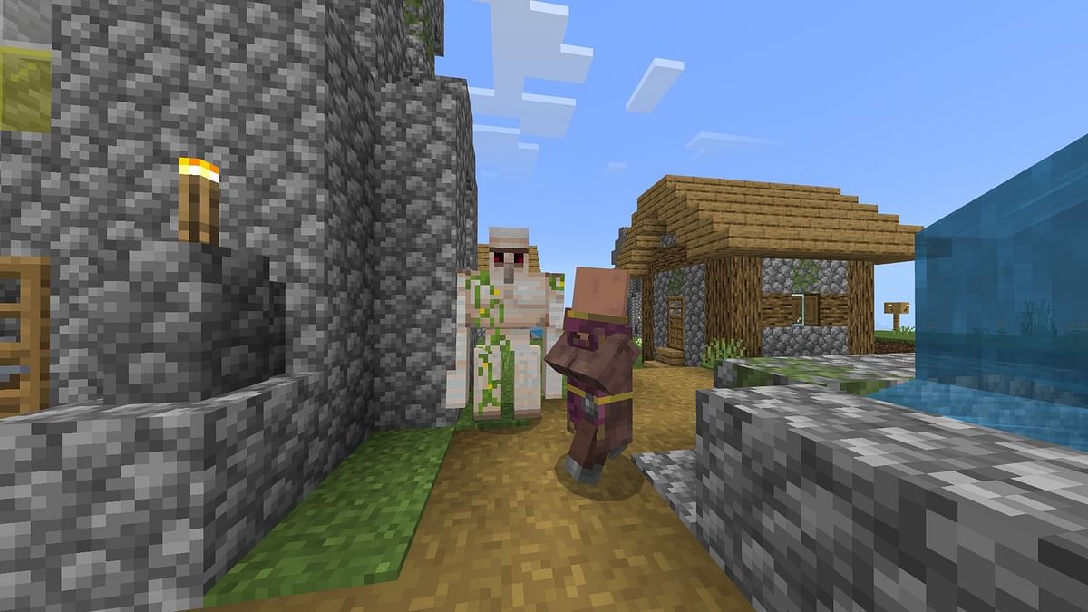 How do iron golems spawn in Minecraft Bedrock?