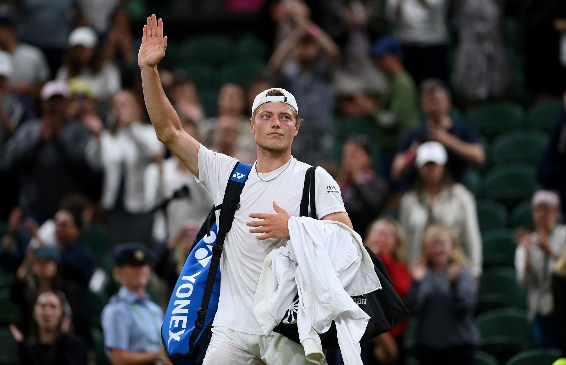 Tim van Rijthoven thanks the crowd after his Wimbledon 2022 match against Novak Djokovic.