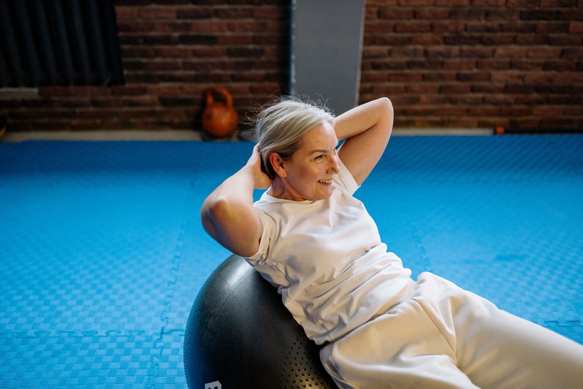 You can also exercise with a ball at home (Image via Pexels/Yan Krukau)