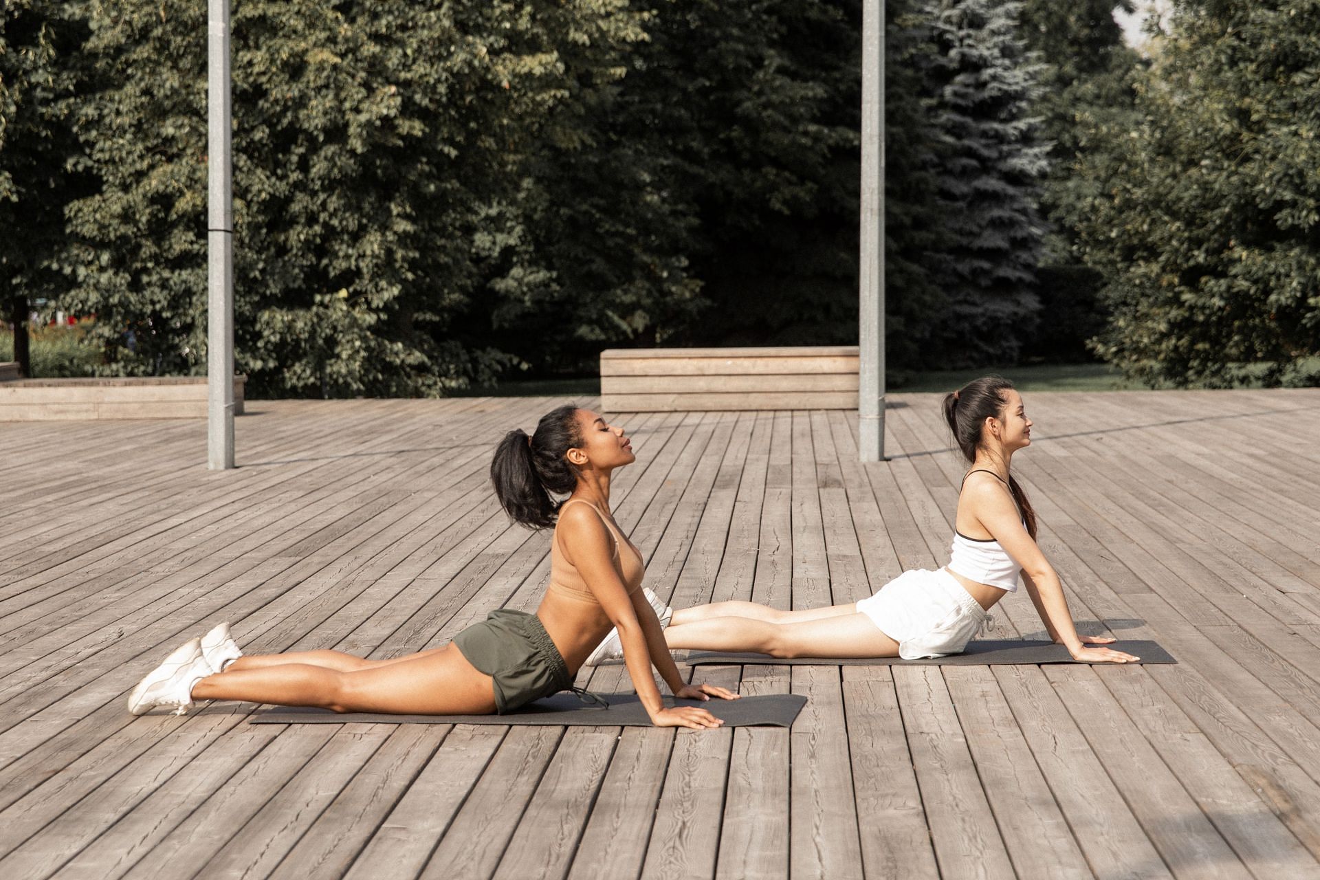 Half cobra pose and cobra pose are some of the best ways to relieve back tension (Image via Pexels/Monstera)