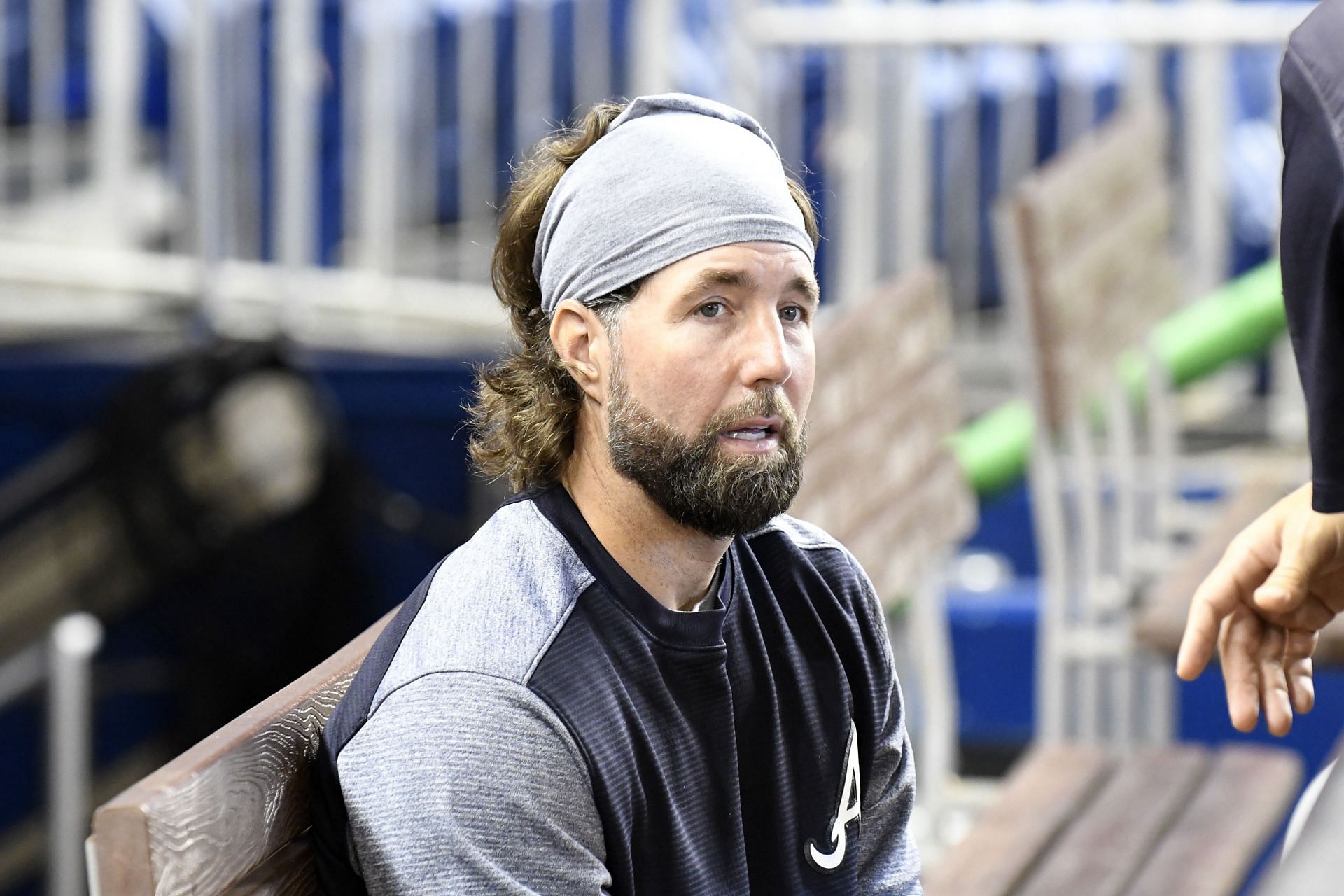 MIAMI, FL - MAY 14: R.A. Dickey #19 of the Atlanta Braves sits in the dugout before the start of the game against the Miami Marlins at Marlins Park on May 14, 2017 in Miami, Florida. (Photo by Eric Espada/Getty Images)