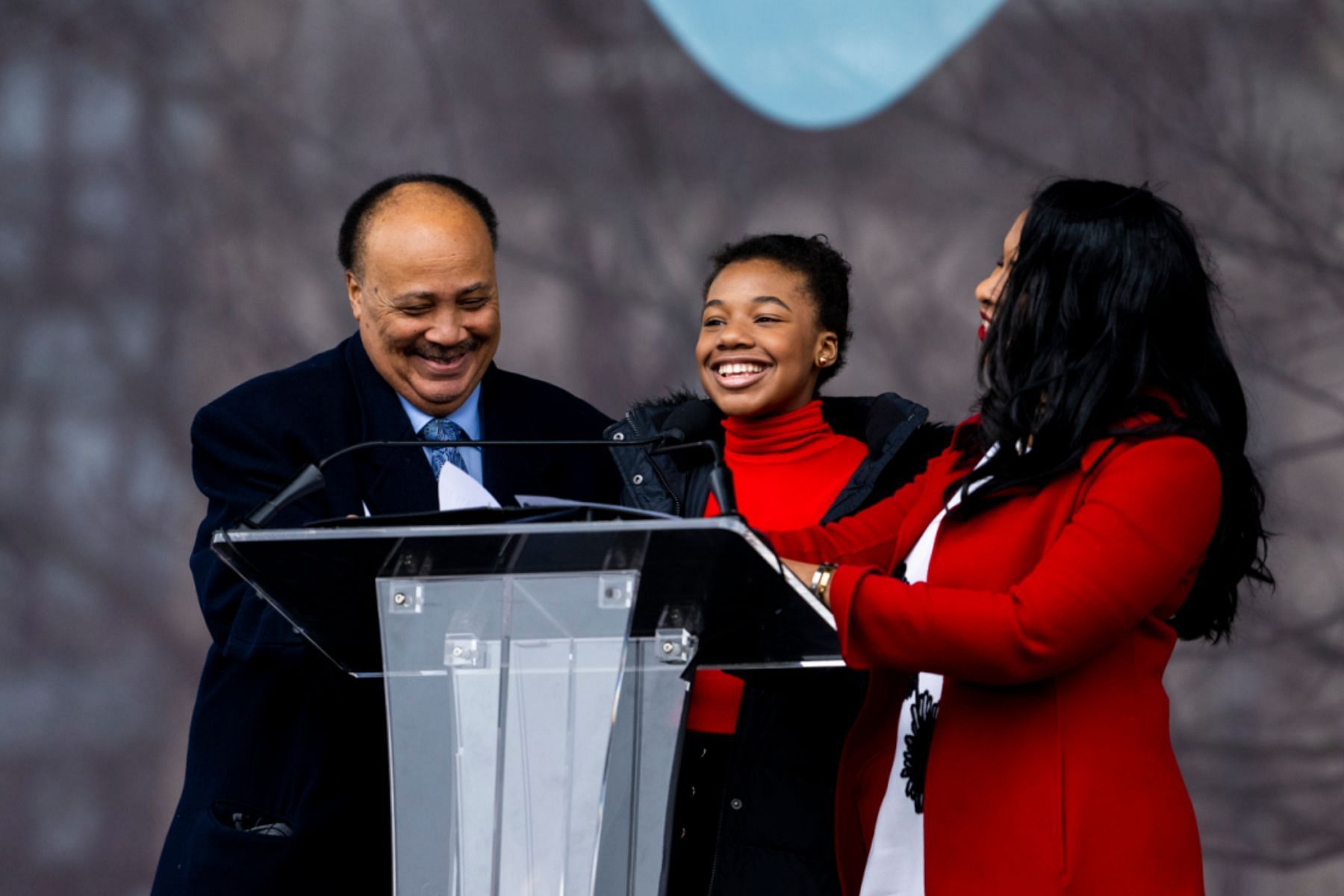 Martin Luther King Jr. III, Yolanda Renee King and Arndrea Waters King speak about The Embrace at Boston Common on Friday. (Image via Alyssa Stone/Northeastern University)