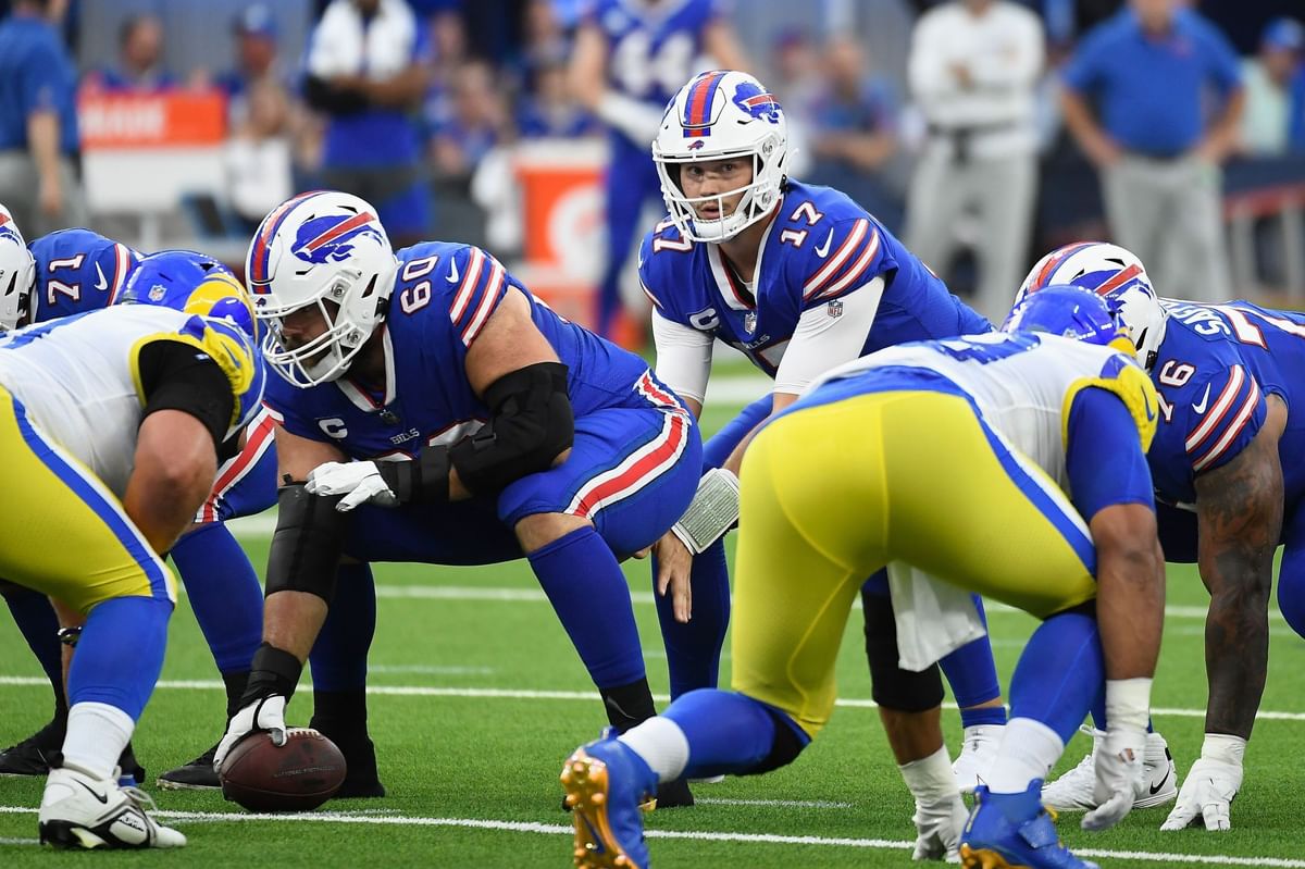 Why do quarterbacks lift their leg before taking a snap?