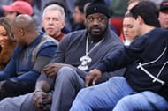 Shaquille O'Neal watching the Dallas Mavericks vs Houston Rockets game.