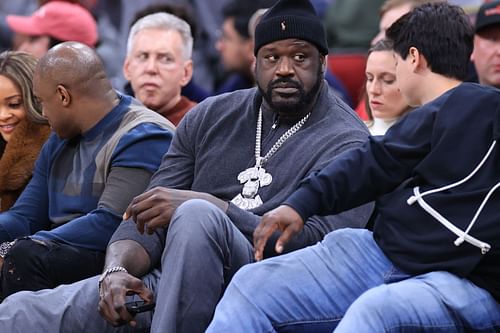 Shaquille O'Neal watching the Dallas Mavericks vs Houston Rockets game.