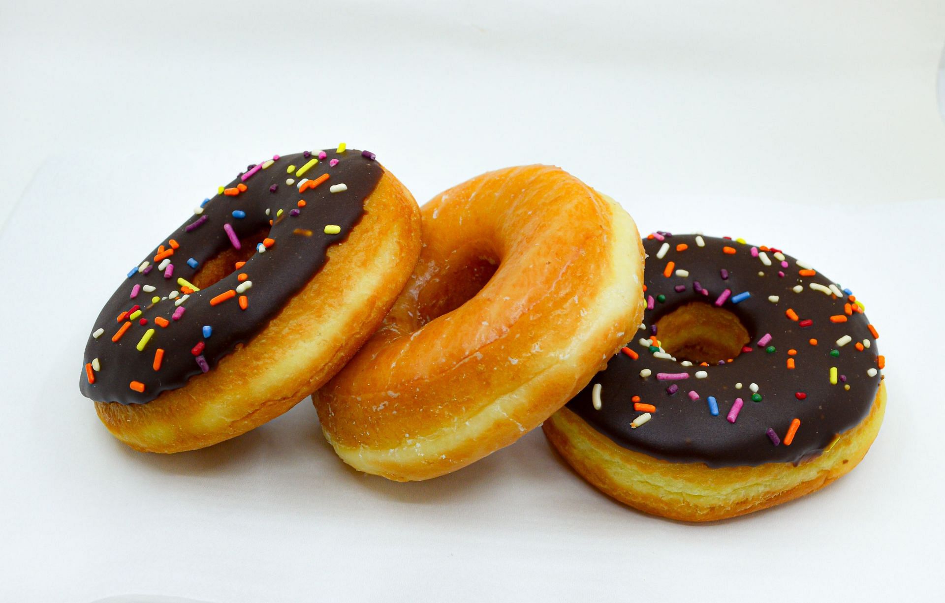 Fried foods like doughnuts can be incredibly unhealthy if you consume them regularly. (Image via Unsplash/Z Graphica)
