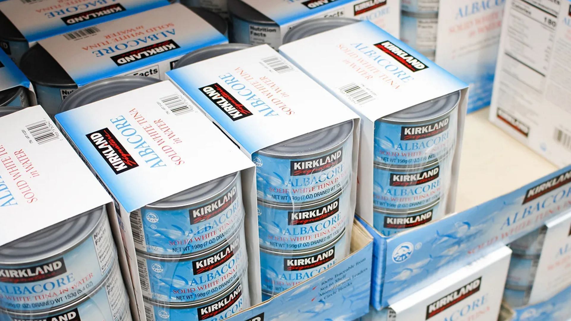 Cans of &#039;Kirkland Signature White Albacore In Water&#039; on a aisle in a Costco store (Image via The Image Party/Shutterstock)