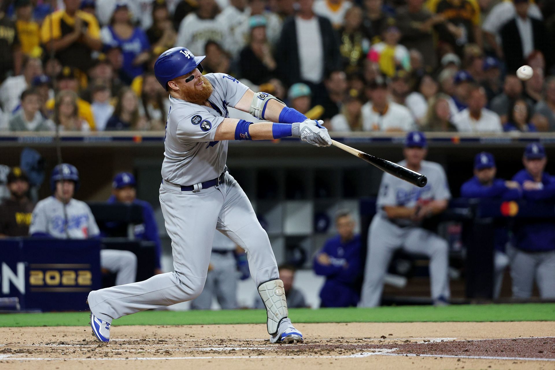 Justin Turner hits a single against the San Diego Padres in game four of the National League Division Series