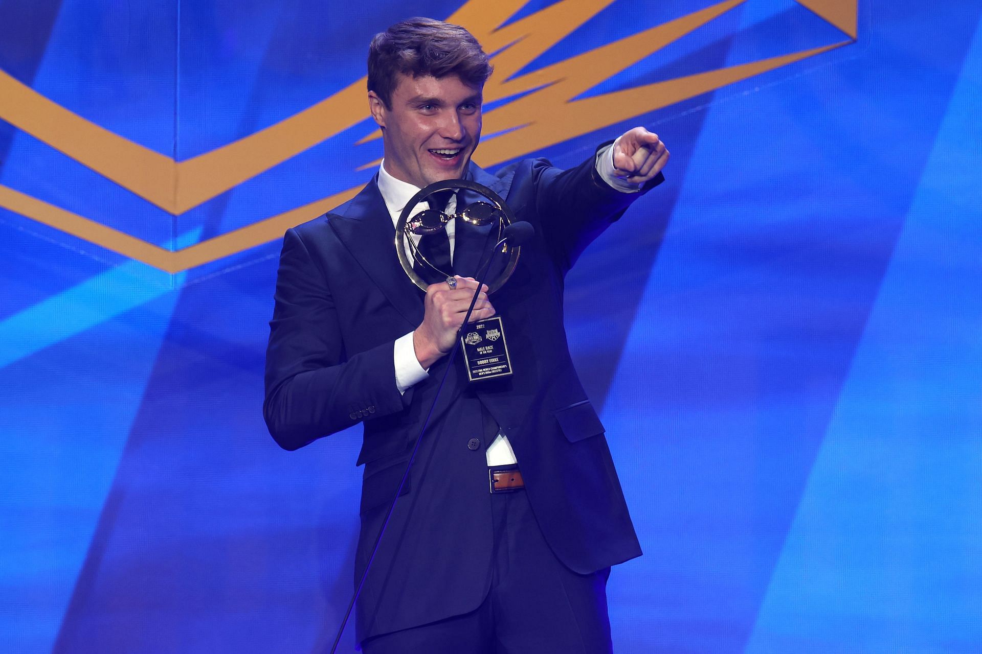 Swimmer Bobby Finke speaks after receiving the Male Race of the Year award during the 2022 Golden Goggle Awards