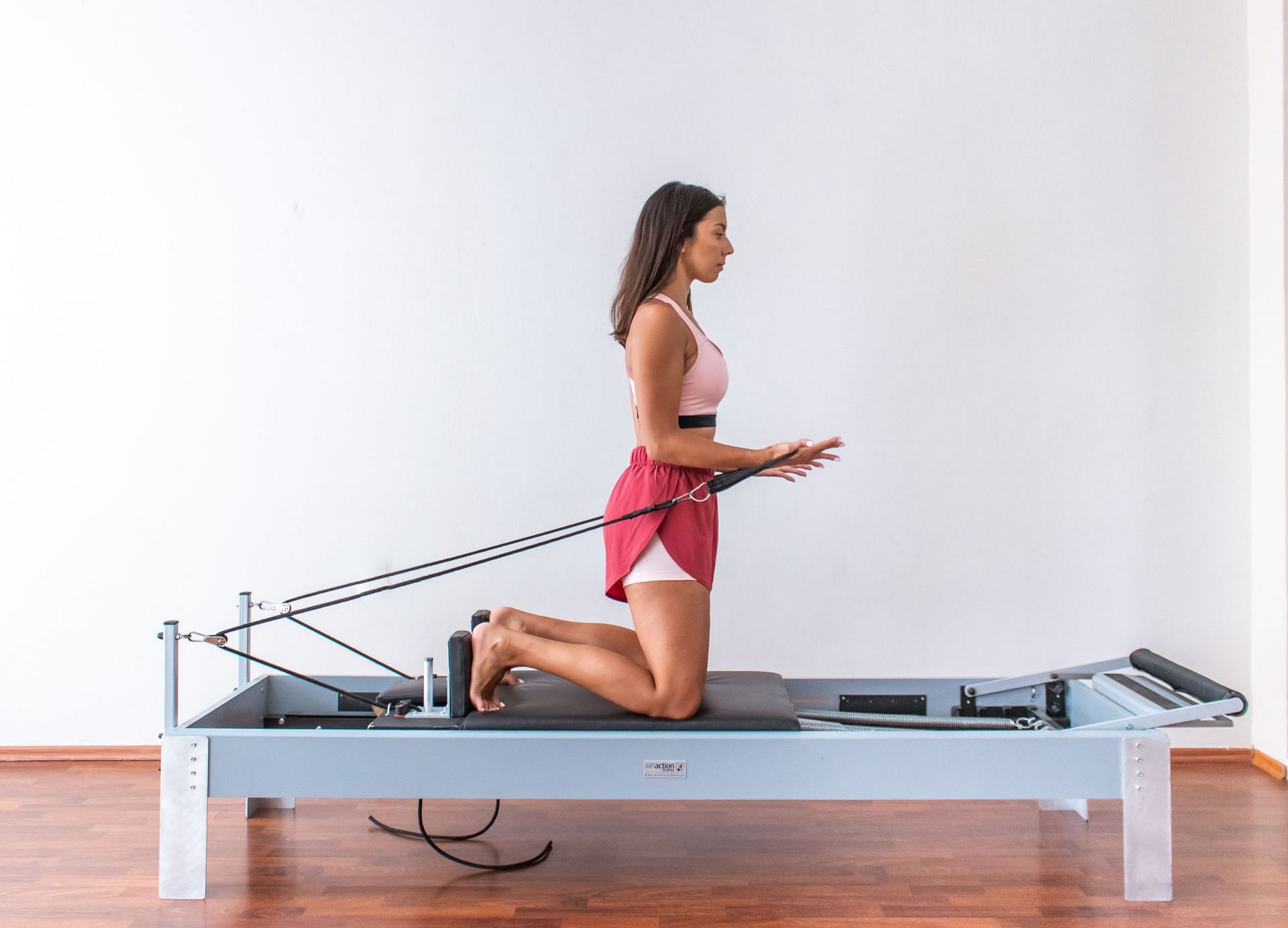 Pilates reformer exercises can help you improve your strength, stability and flexibility (Image via Pexels/Maria Charizani)