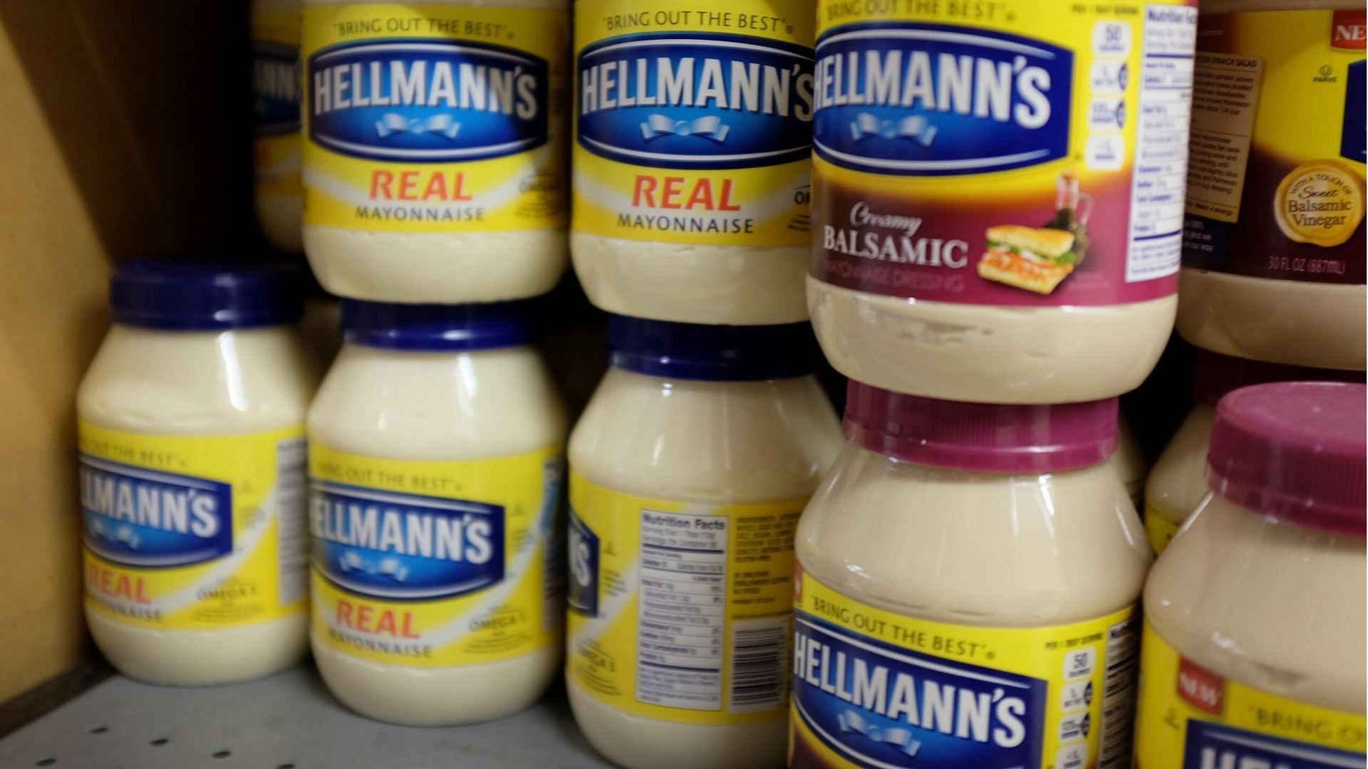 The Unilever-owned Mayo brand, Hellmann&#039;s, is displayed on shelves in a grocery store (Image via Joe Raedle/Getty Images)