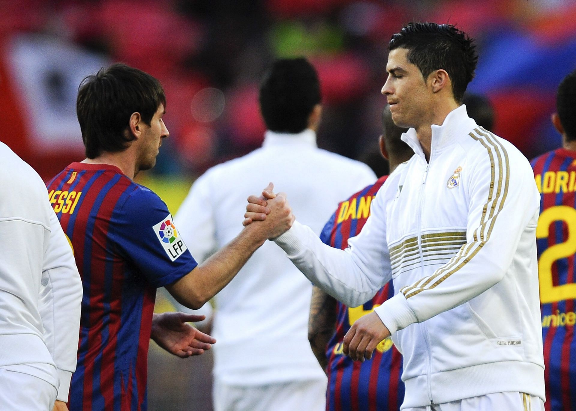 Lionel Messi and Cristiano Ronaldo shake hands before a LaLiga match in 2012