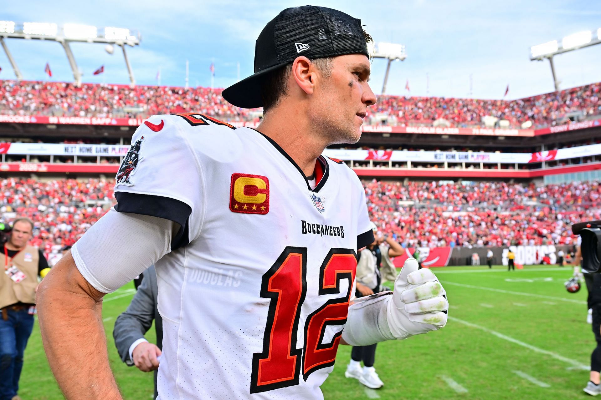 Tom Brady of the Tampa Bay Buccaneers runs off the field after the game against the Carolina Panthers.