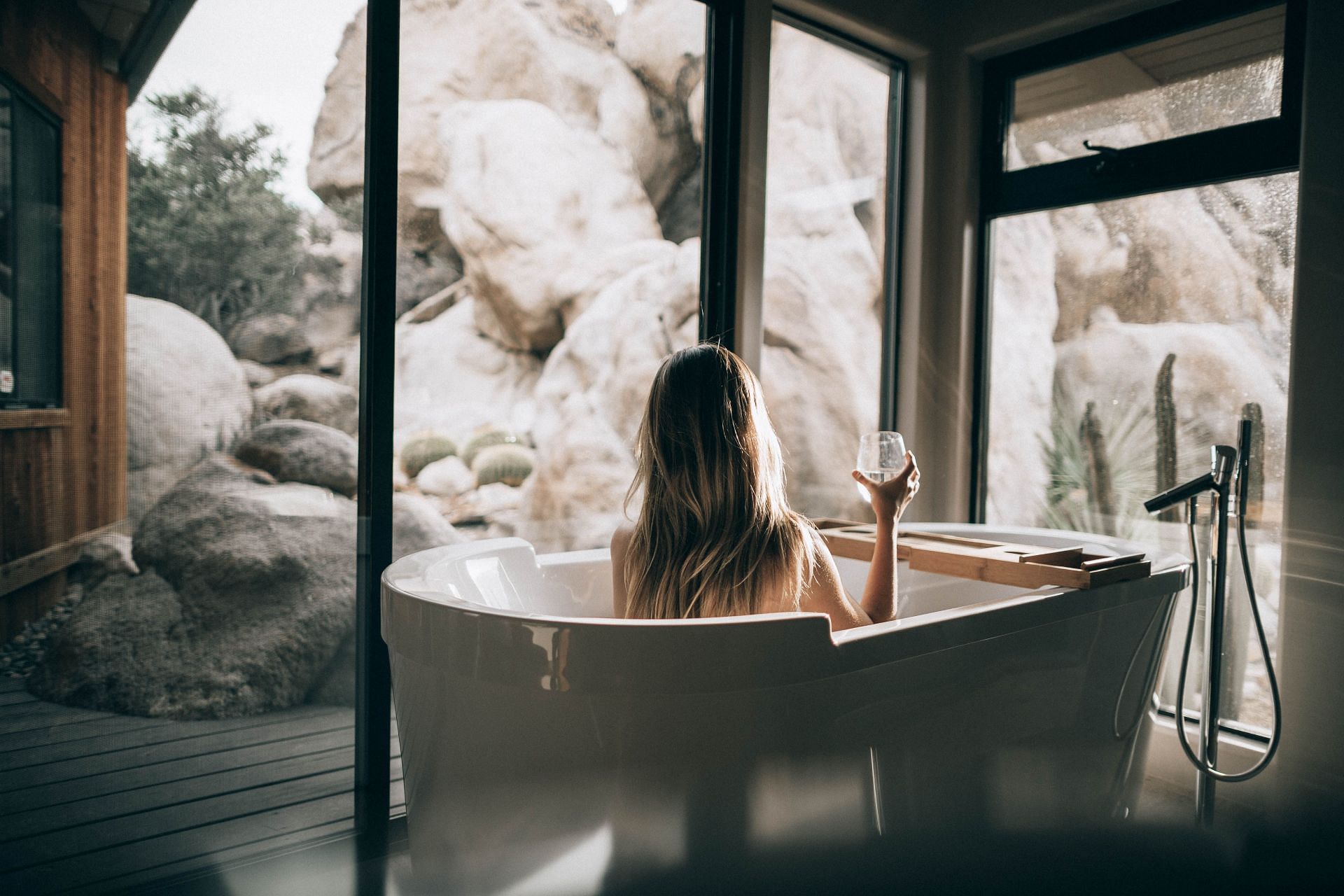 Hot showers can improve sleep quality (Image via Unsplash/Roberto Nickson)