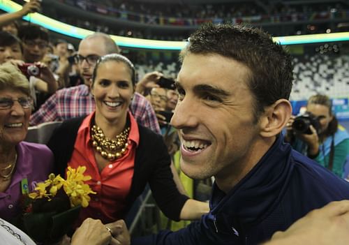 Michael Phelps of the United States smiles with sister Hilary Phelps after the Men's 4x200m Freestyle during Day Fourteen of the 14th FINA World Championships at the Oriental Sports Center on July 29, 2011 in Shanghai, China. (Photo by Ezra Shaw/Getty Images)