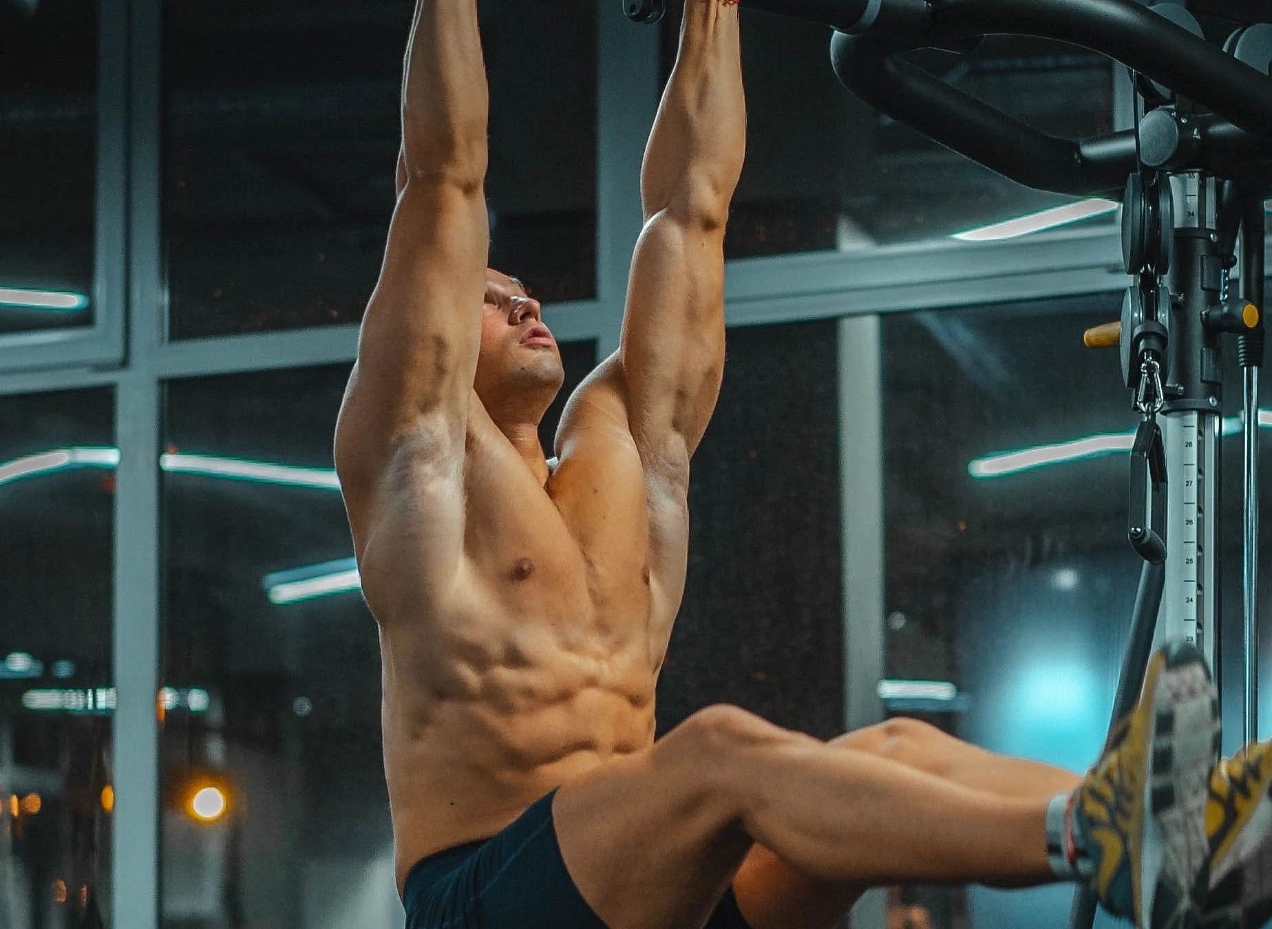 Hanging leg raises (Photo via Unsplash/ Karolis Milisauskas)