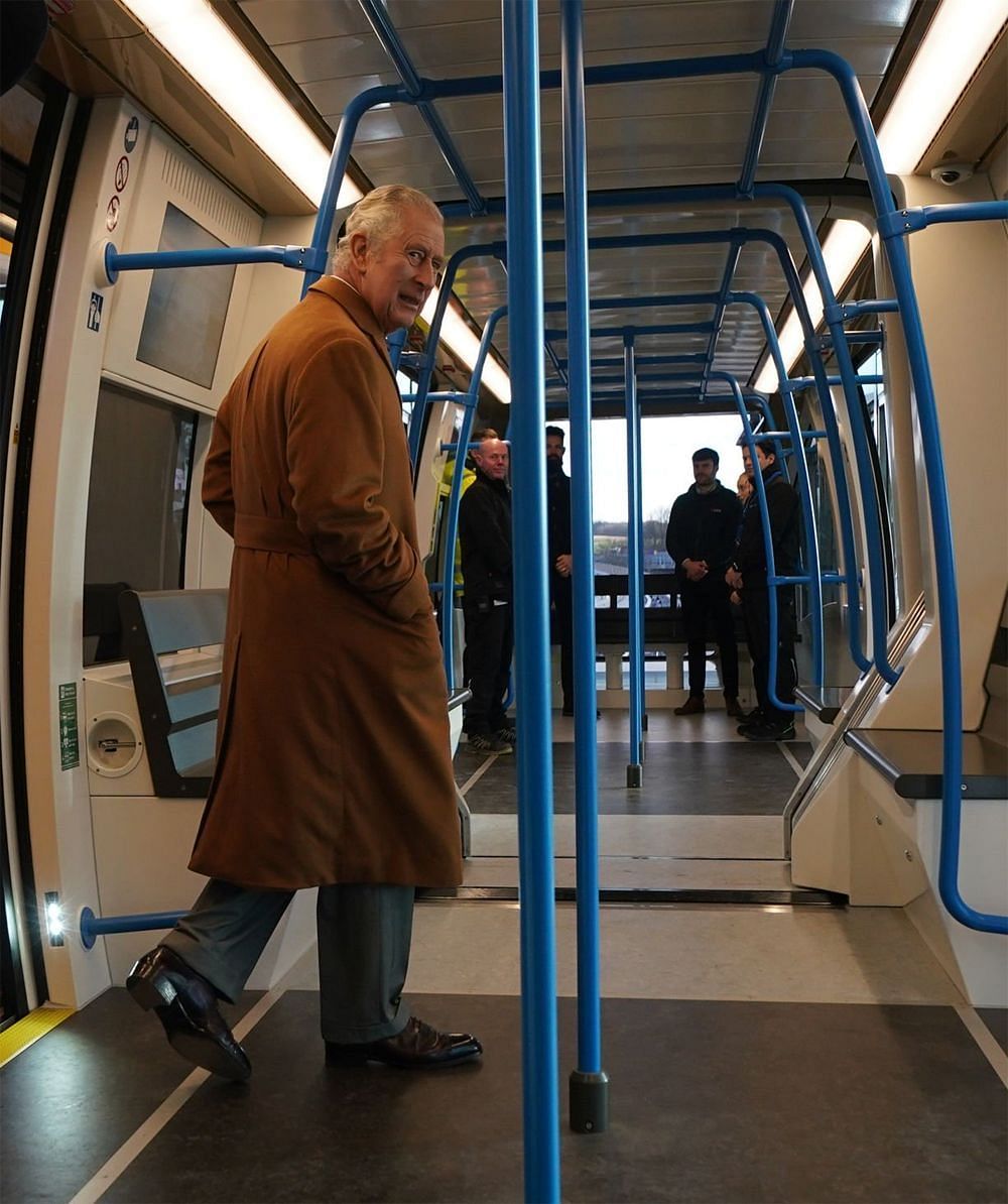 King Charles visiting the DART transit system in Luton (Image via Getty Images)