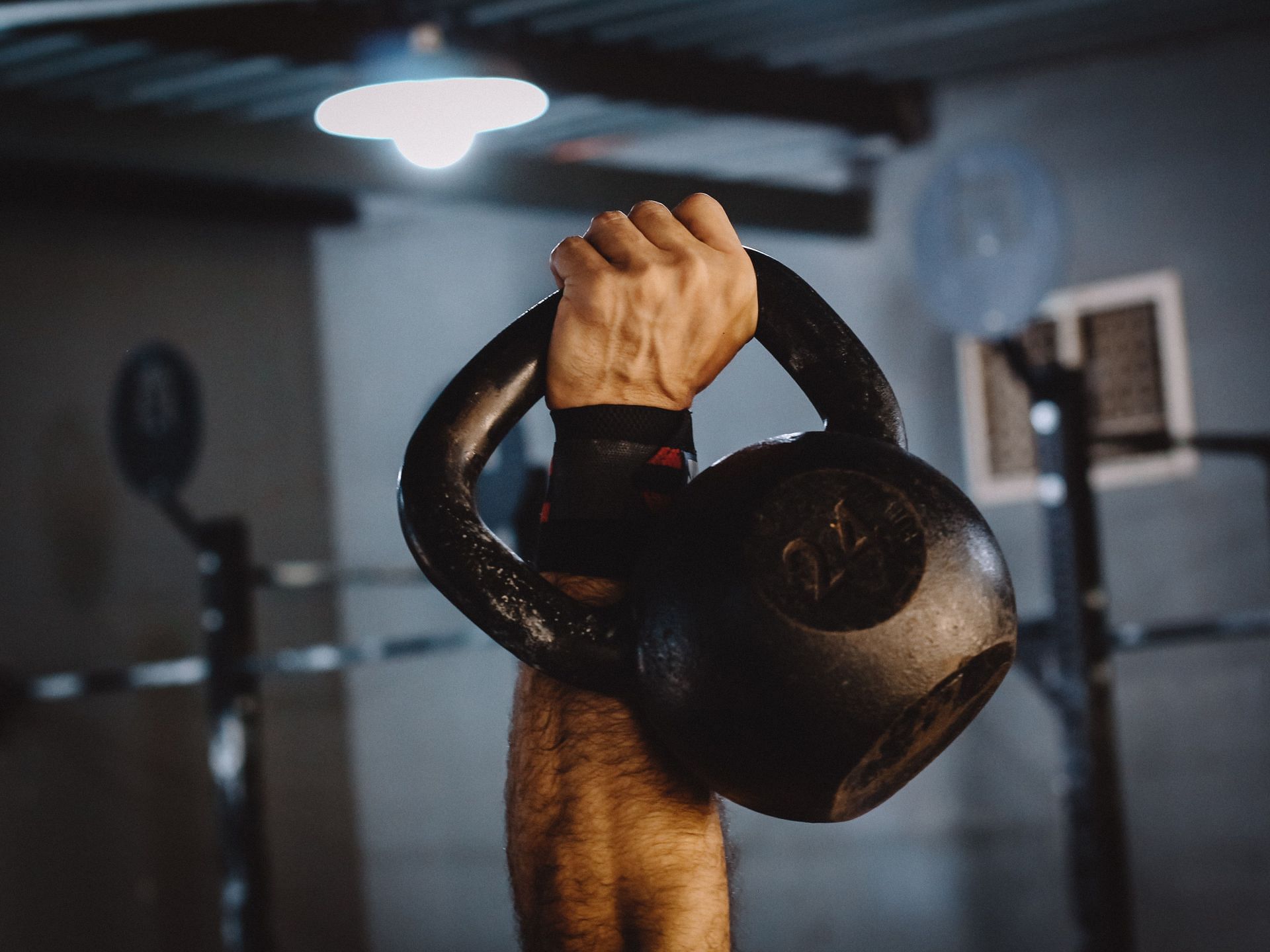 The kettlebell push press is a great way to train your triceps and chest! (Image via pexels/Geancarlo Peruzzolo)