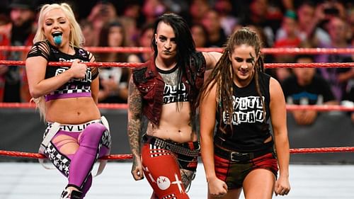 Liv Morgan (Left), Ruby Soho (Center), Sarah Logan (Right) as the Riott Squad.