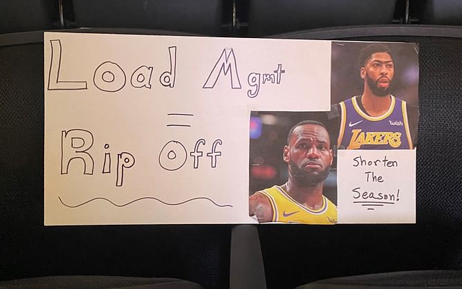 Watch: Fan leaves a "shorten the season" sign at Lakers-Nets contest as LeBron James and Anthony Davis miss the game
