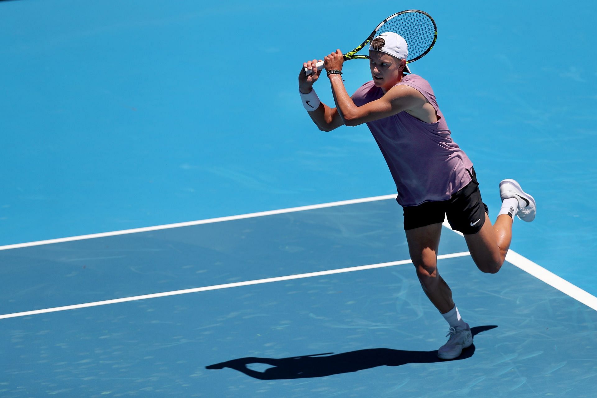 Holger Rune plays a backhand during a practice session ahead of the 2023 Australian Open