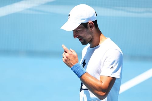 Novak Djokovic looks on during a practice session ahead of the 2023 Australian Open