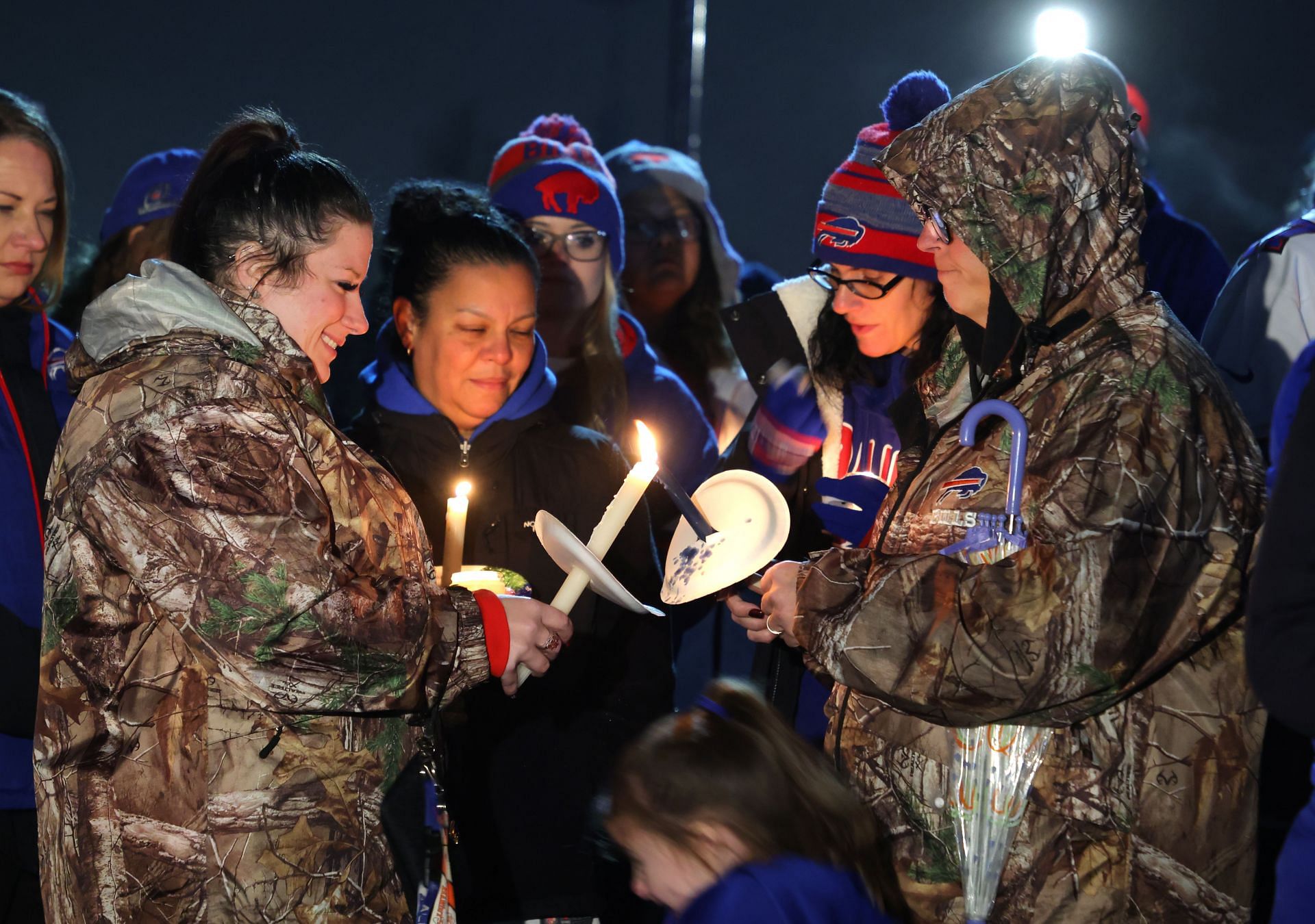 Fans gather outside Highmark Stadiumfollowing the hospitalization of Buffalo Bills safety Damar Hamlin.