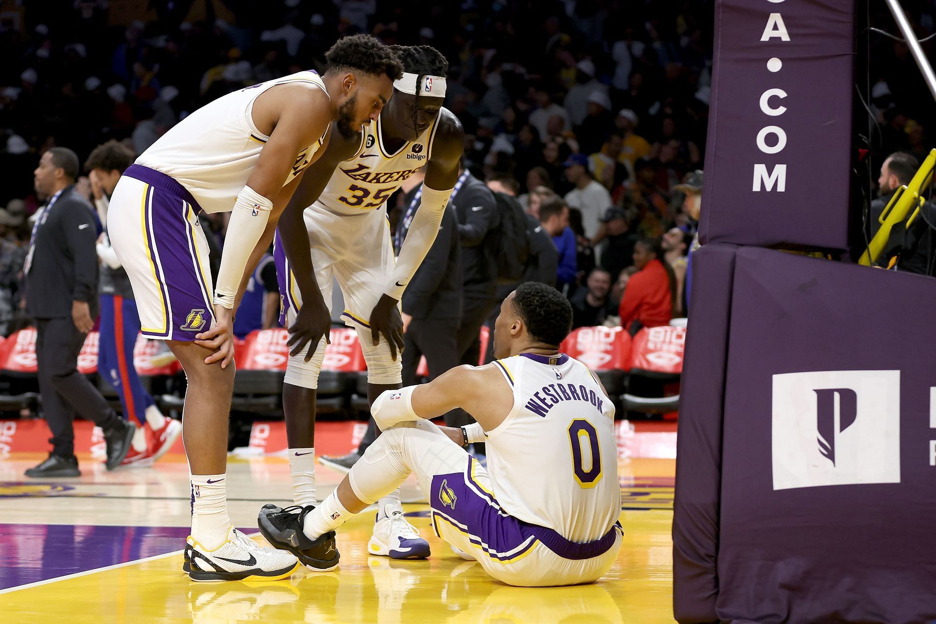 LA Lakers veteran point guard Russell Westbrook getting consoled by his teammates after missing his game-winning layup attempt over Joel Embiid