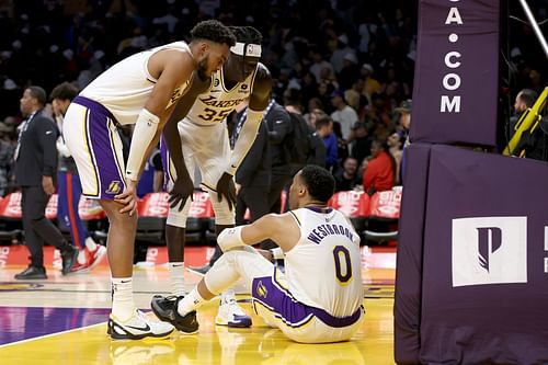 LA Lakers veteran point guard Russell Westbrook getting consoled by his teammates after missing his game-winning layup attempt over Joel Embiid