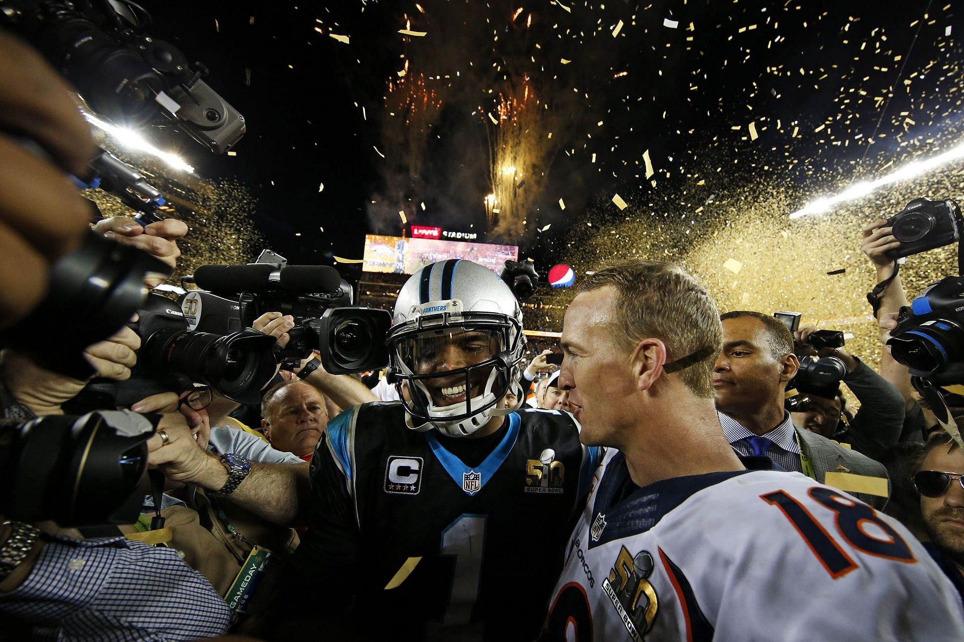 Carolina Panthers quarterback Cam Newton, left, and Denver Broncos quarterback Peyton Manning