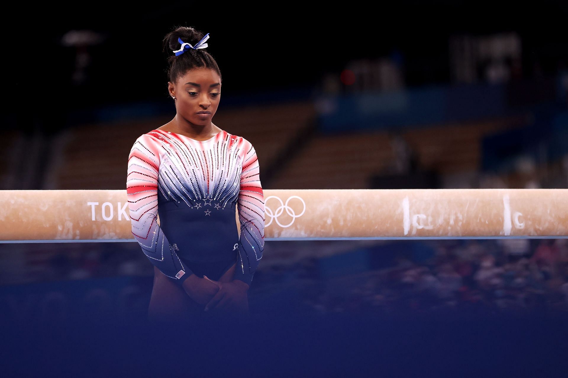 Simone Biles competes in the Women&#039;s Balance Beam Final at the Tokyo 2020 Olympic Games (Photo by Laurence Griffiths/Getty Images)